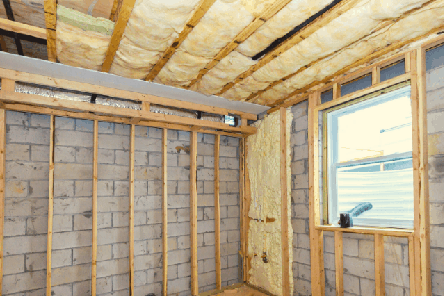 Fiberglass insulation in wall and ceiling cavities