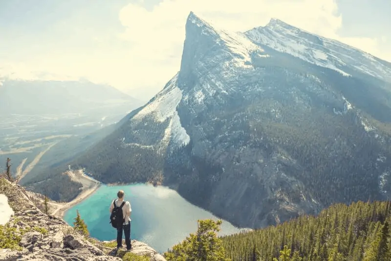 a man staring in silence at a mountain