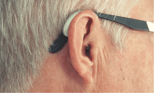Auditive aparel in a man's ear