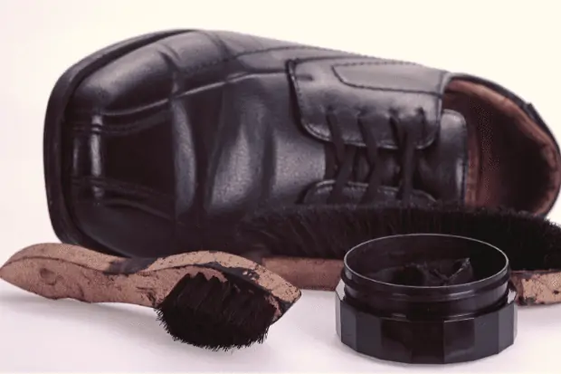 Image showing shoes and polish. Caring for leather is a good option for how to stop shoes from squeaking.
