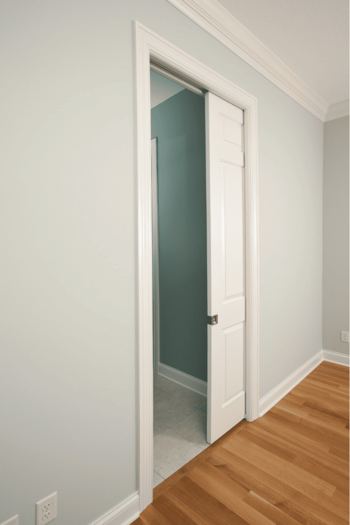 Picture of a pocket door half opened.